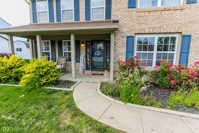 7710 Samuel Dr, Indianapolis, IN 46259 - entrance to property featuring covered porch and brick siding