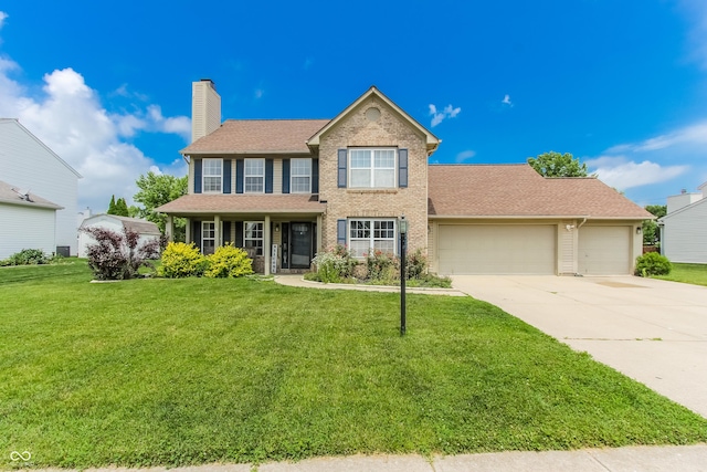 7710 Samuel Dr, Indianapolis, IN 46259 - colonial-style house featuring concrete driveway, an attached garage, a front yard, a chimney, and brick siding