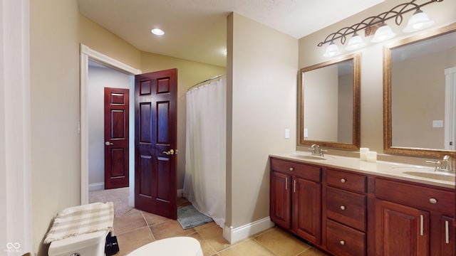3306 Mullinix Rd, Greenwood, IN 46143 - bathroom with double vanity, tile patterned flooring, and curtained shower