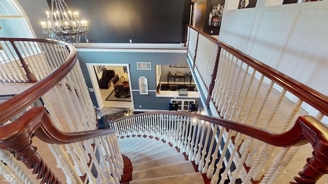 3306 Mullinix Rd, Greenwood, IN 46143 - staircase with a chandelier and baseboards