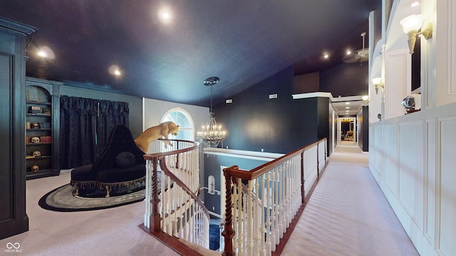 3306 Mullinix Rd, Greenwood, IN 46143 - hall featuring carpet floors, lofted ceiling, an upstairs landing, a chandelier, and recessed lighting