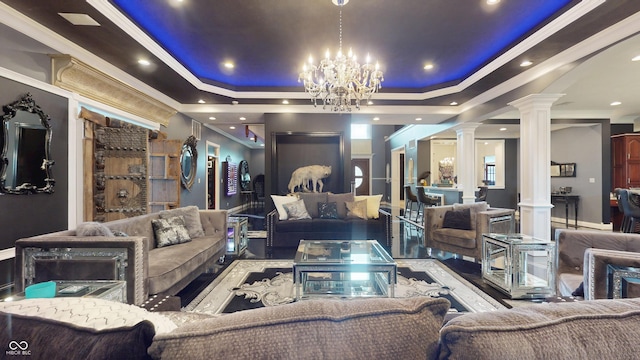 3306 Mullinix Rd, Greenwood, IN 46143 - living room with ornate columns, a tray ceiling, ornamental molding, and a chandelier