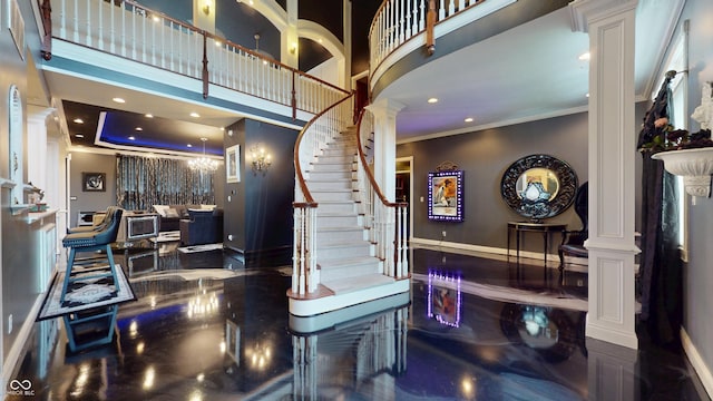 3306 Mullinix Rd, Greenwood, IN 46143 - foyer entrance with decorative columns, crown molding, stairs, a high ceiling, and recessed lighting