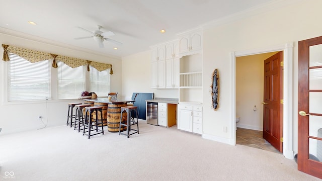 3306 Mullinix Rd, Greenwood, IN 46143 - dining space featuring light colored carpet, ornamental molding, ceiling fan, and recessed lighting