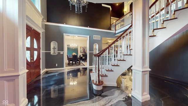3306 Mullinix Rd, Greenwood, IN 46143 - foyer with a chandelier, stairway, and a high ceiling