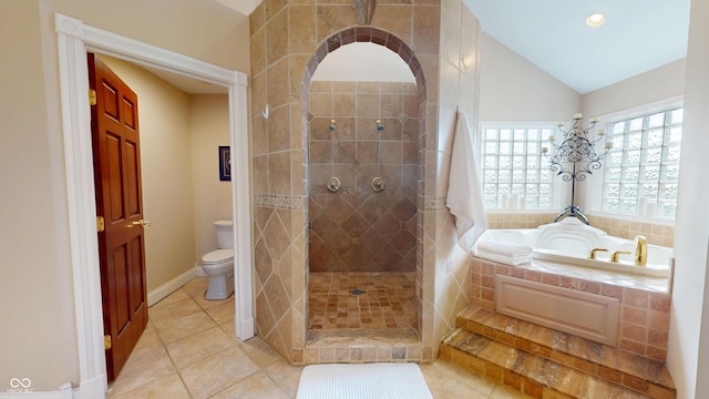 3306 Mullinix Rd, Greenwood, IN 46143 - full bathroom featuring a bath, tiled shower, tile patterned flooring, lofted ceiling, and recessed lighting