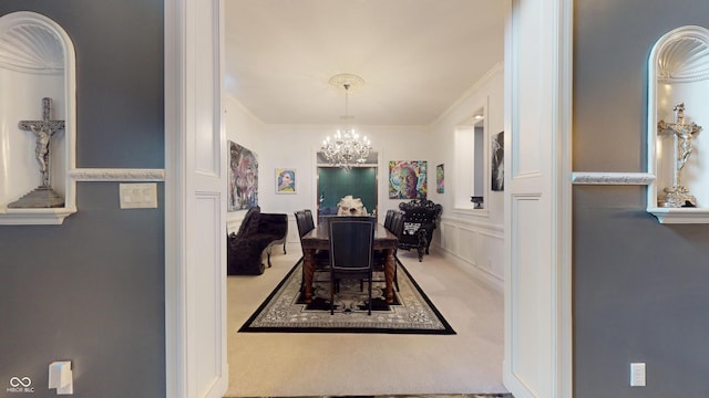 3306 Mullinix Rd, Greenwood, IN 46143 - carpeted dining area with a chandelier and crown molding