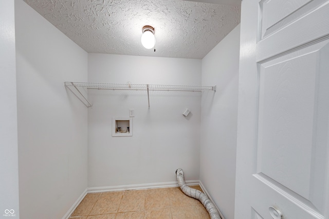 8178 Foxchase Cir, Indianapolis, IN 46256 - washroom featuring hookup for a washing machine, a textured ceiling, light tile patterned floors, and electric dryer hookup