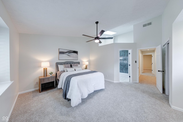 8178 Foxchase Cir, Indianapolis, IN 46256 - bedroom featuring carpet floors, lofted ceiling, a skylight, and ceiling fan
