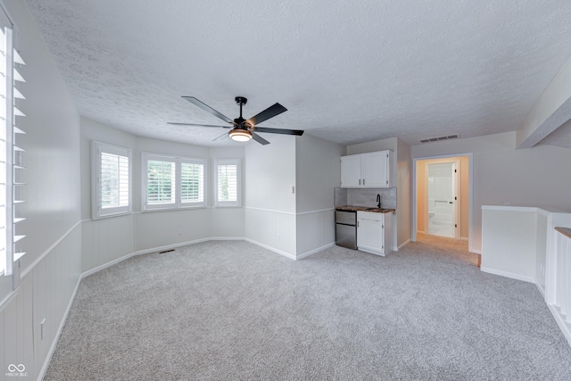 8178 Foxchase Cir, Indianapolis, IN 46256 - unfurnished living room with a textured ceiling, light carpet, and a ceiling fan