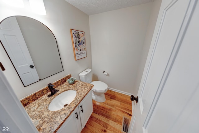 8178 Foxchase Cir, Indianapolis, IN 46256 - bathroom with wood finished floors, vanity, and a textured ceiling