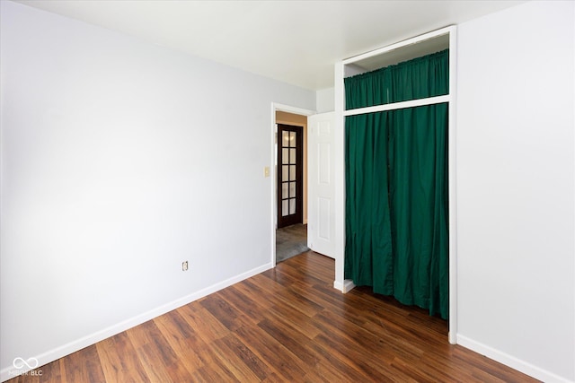 220 E Tilden Dr, Brownsburg, IN 46112 - spare room featuring baseboards and dark wood-style floors