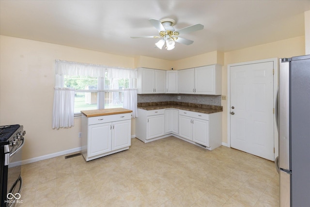 220 E Tilden Dr, Brownsburg, IN 46112 - kitchen featuring stainless steel appliances, white cabinetry, ceiling fan, and butcher block counters