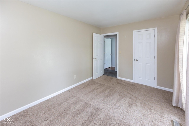 220 E Tilden Dr, Brownsburg, IN 46112 - unfurnished bedroom with carpet floors and baseboards