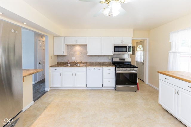 220 E Tilden Dr, Brownsburg, IN 46112 - kitchen featuring stainless steel appliances, plenty of natural light, white cabinetry, and backsplash