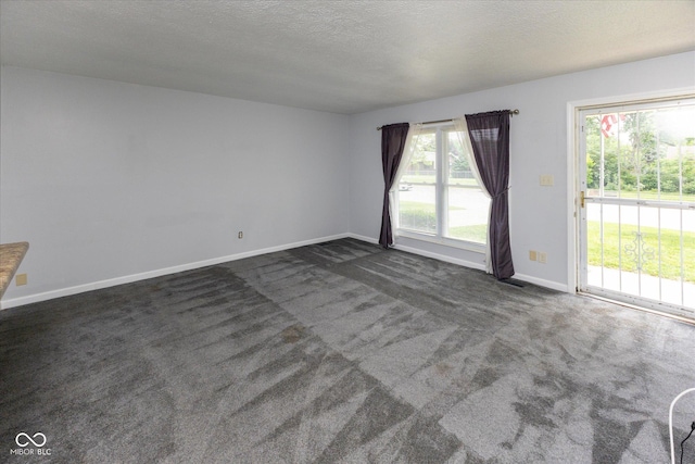 220 E Tilden Dr, Brownsburg, IN 46112 - spare room featuring dark carpet and a textured ceiling