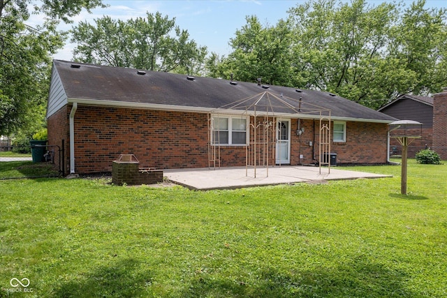 220 E Tilden Dr, Brownsburg, IN 46112 - rear view of property featuring a patio, brick siding, and roof with shingles