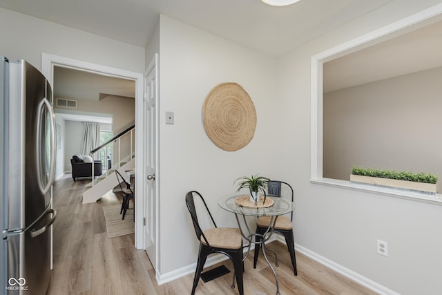 49 Druid Hill Ct Unit 0, Carmel, IN 46032 - dining area featuring light wood-style flooring and stairs