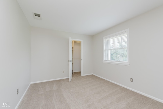 49 Druid Hill Ct Unit 0, Carmel, IN 46032 - unfurnished bedroom with carpet floors, a spacious closet, and a closet