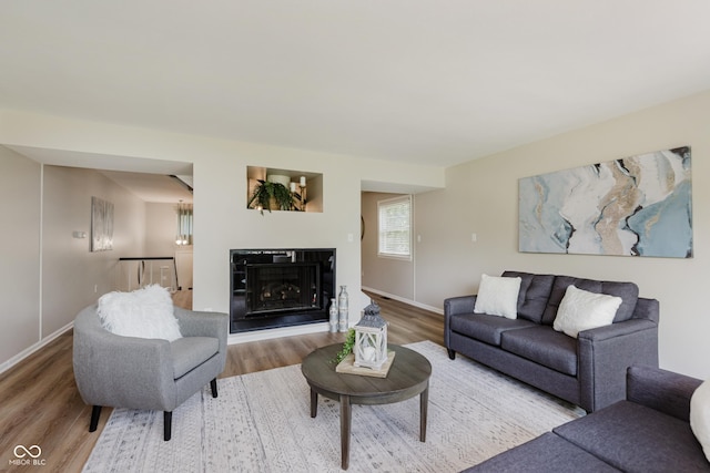 49 Druid Hill Ct Unit 0, Carmel, IN 46032 - living area with wood finished floors and a glass covered fireplace