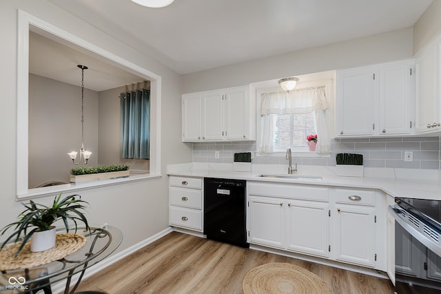 49 Druid Hill Ct Unit 0, Carmel, IN 46032 - kitchen with black dishwasher, light wood finished floors, white cabinets, and backsplash