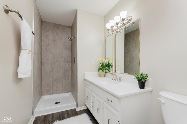 49 Druid Hill Ct Unit 0, Carmel, IN 46032 - full bathroom featuring vanity, a tile shower, and wood finished floors
