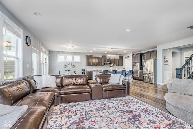 12634 Mustard Seed Ct, Fishers, IN 46038 - living room with wood finished floors, stairs, and recessed lighting