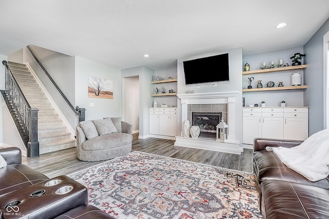 12634 Mustard Seed Ct, Fishers, IN 46038 - living area with wood finished floors, stairway, a fireplace, and recessed lighting
