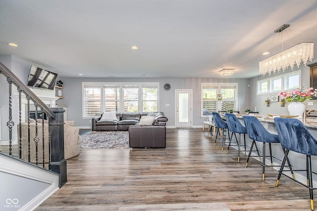 12634 Mustard Seed Ct, Fishers, IN 46038 - living area featuring recessed lighting, wood finished floors, and a chandelier