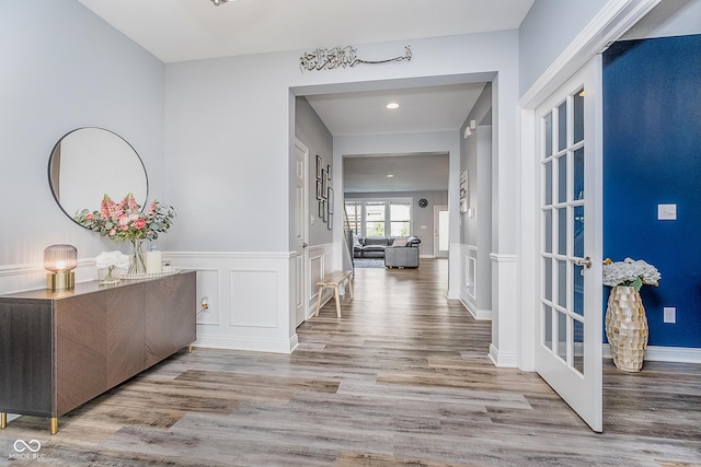 12634 Mustard Seed Ct, Fishers, IN 46038 - hall with wood finished floors, a wainscoted wall, recessed lighting, and a decorative wall