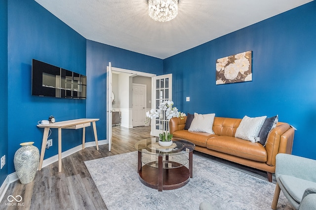 12634 Mustard Seed Ct, Fishers, IN 46038 - living area with wood finished floors and a chandelier