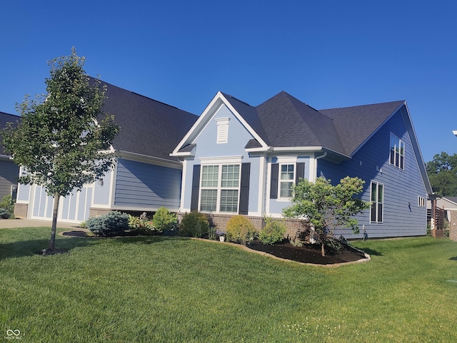 12634 Mustard Seed Ct, Fishers, IN 46038 - traditional-style home with a front lawn, roof with shingles, and brick siding