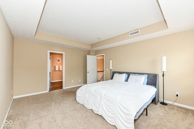13700 Stanford Dr, Carmel, IN 46074 - carpeted bedroom featuring a raised ceiling and baseboards