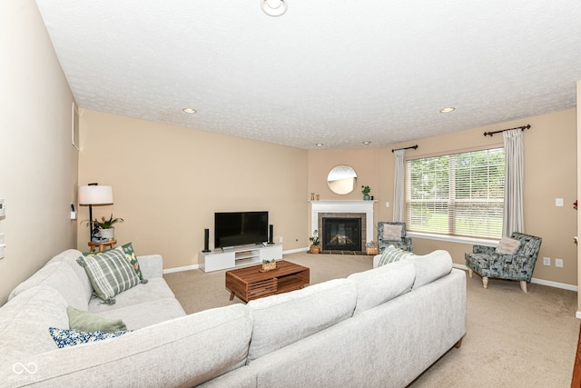 13700 Stanford Dr, Carmel, IN 46074 - living room featuring light carpet, a tile fireplace, a textured ceiling, and recessed lighting