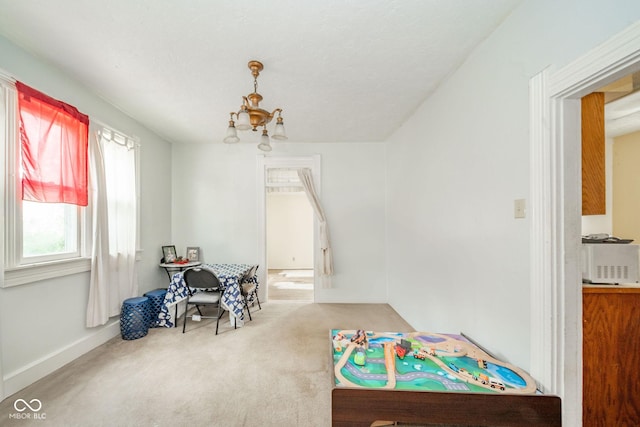 917 W 8th St, Anderson, IN 46016 - playroom with carpet flooring and a chandelier