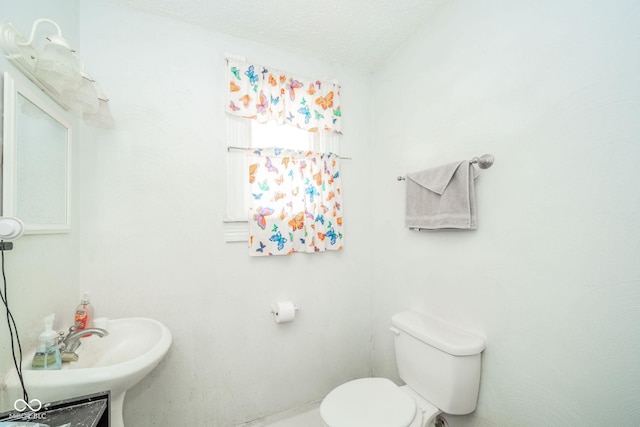 917 W 8th St, Anderson, IN 46016 - half bathroom with toilet and a textured ceiling