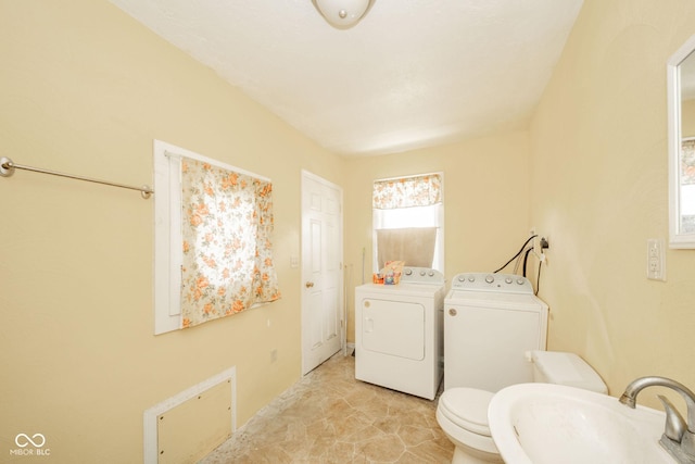917 W 8th St, Anderson, IN 46016 - bathroom featuring independent washer and dryer and a sink