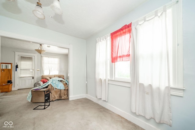 917 W 8th St, Anderson, IN 46016 - sitting room with carpet and baseboards
