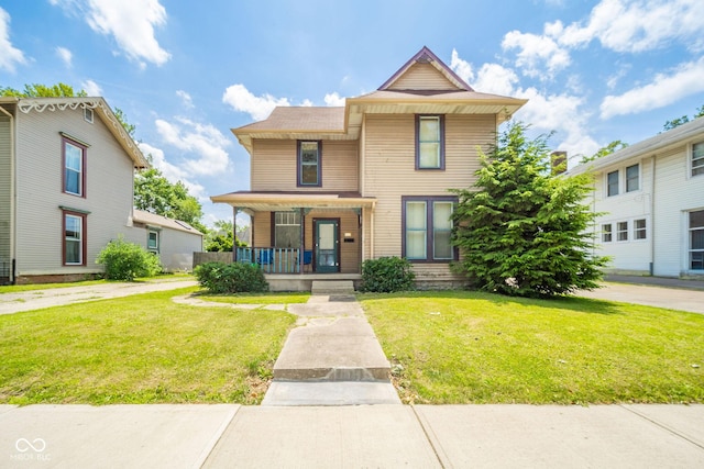 917 W 8th St, Anderson, IN 46016 - view of front facade with covered porch and a front yard