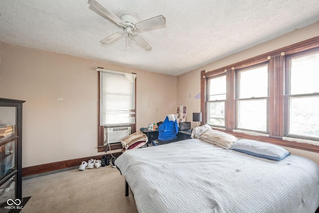 917 W 8th St, Anderson, IN 46016 - bedroom featuring multiple windows, carpet flooring, a textured ceiling, a ceiling fan, and cooling unit