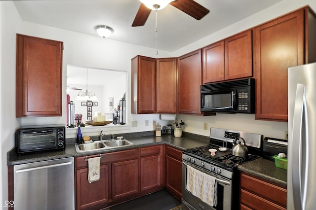 2253 Bridlewood Dr, Franklin, IN 46131 - kitchen featuring stainless steel appliances, dark countertops, and ceiling fan