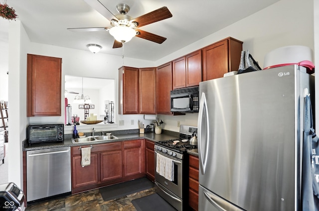 2253 Bridlewood Dr, Franklin, IN 46131 - kitchen with stainless steel appliances, dark countertops, ceiling fan, and dark stone finish floors