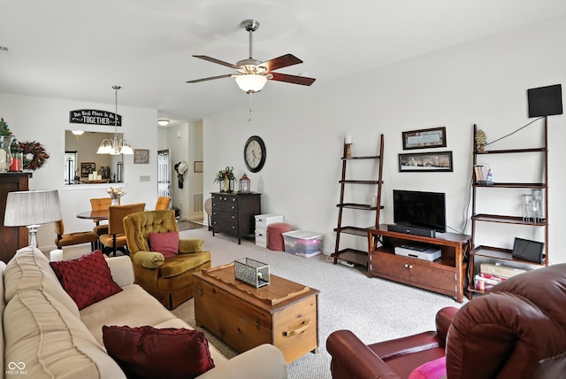 2253 Bridlewood Dr, Franklin, IN 46131 - living area with ceiling fan, a chandelier, and carpet flooring