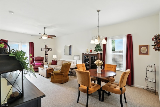 2253 Bridlewood Dr, Franklin, IN 46131 - dining space featuring light colored carpet, healthy amount of natural light, and a chandelier