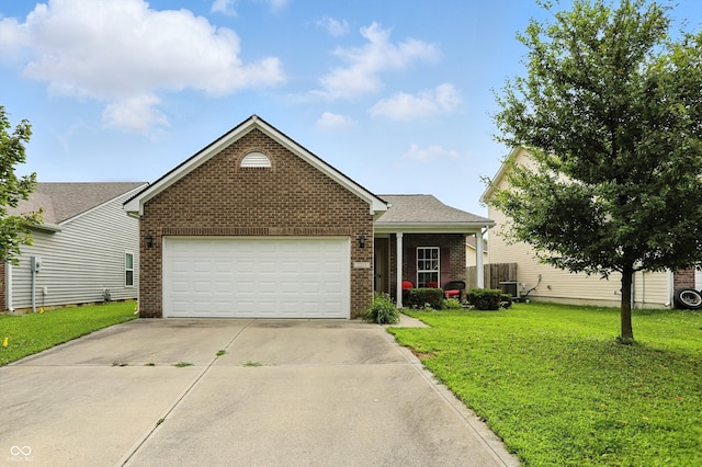 2253 Bridlewood Dr, Franklin, IN 46131 - view of front facade with brick siding, driveway, a front yard, and an attached garage