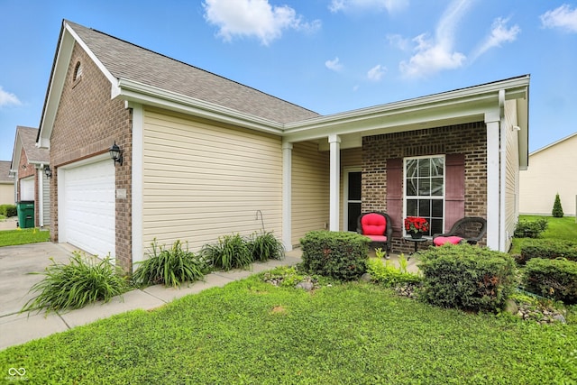 2253 Bridlewood Dr, Franklin, IN 46131 - view of side of property featuring brick siding, a garage, driveway, and covered porch