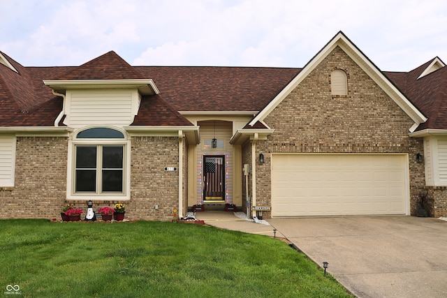 650 S Eagles Way, Crawfordsville, IN 47933 - view of front of property with concrete driveway, a front yard, brick siding, roof with shingles, and an attached garage