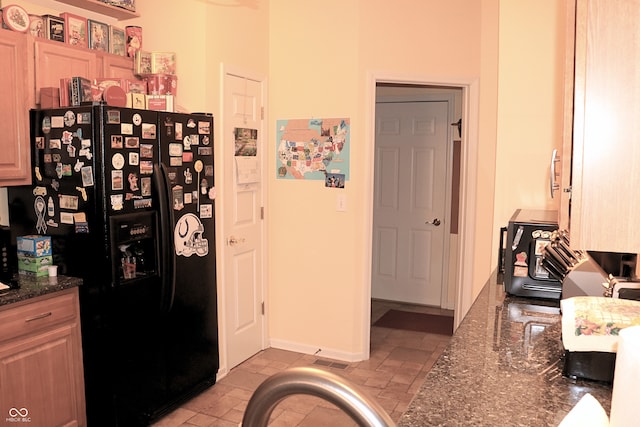650 S Eagles Way, Crawfordsville, IN 47933 - kitchen featuring black fridge and dark stone countertops