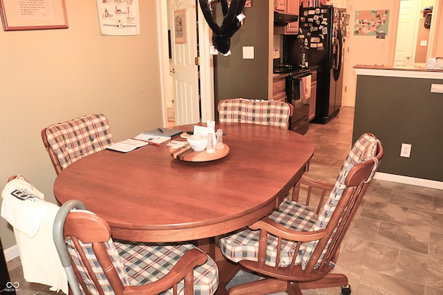 650 S Eagles Way, Crawfordsville, IN 47933 - dining space with bar with sink and stone finish flooring
