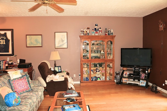 650 S Eagles Way, Crawfordsville, IN 47933 - living room featuring wood finished floors, ceiling fan, and a textured ceiling